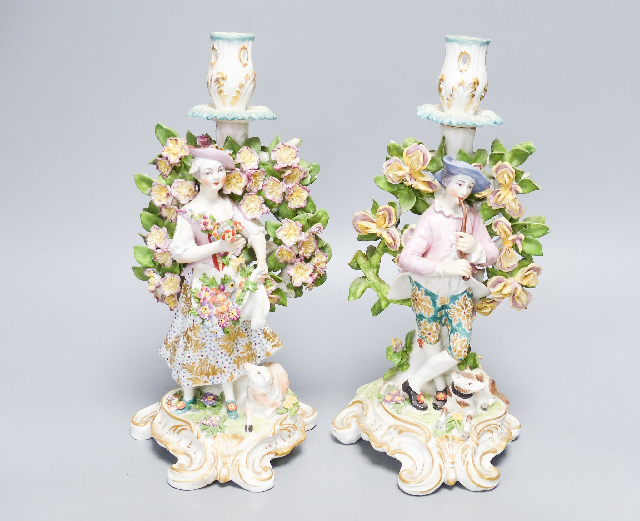 A pair of Derby style candlestick figures, height 27cm